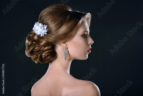 Profile of sexy blond woman with wedding hairstyle