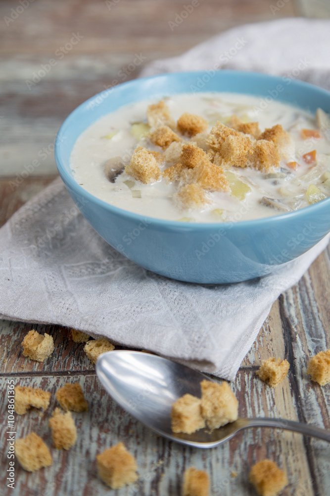 Creamy Mushroom Soup on a wooden background Creamy Mushroom Soup on a wooden background