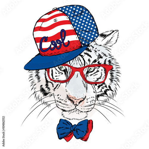 Fototapeta Naklejka Na Ścianę i Meble -  Vector tiger wearing glasses and a cap. Hipster. Greeting card with a tiger. Rap. Hip-hop.