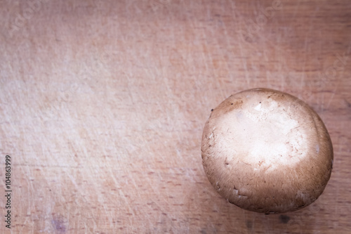 Brown champignon on cutting board 