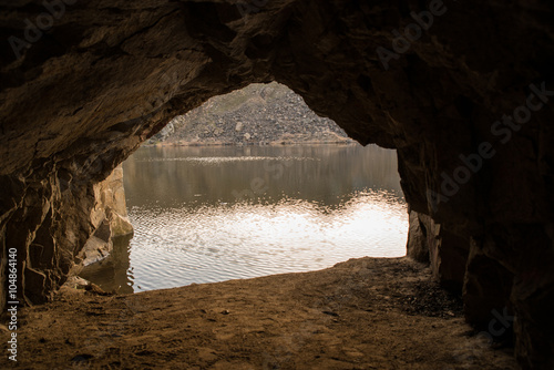 rock cave and lake