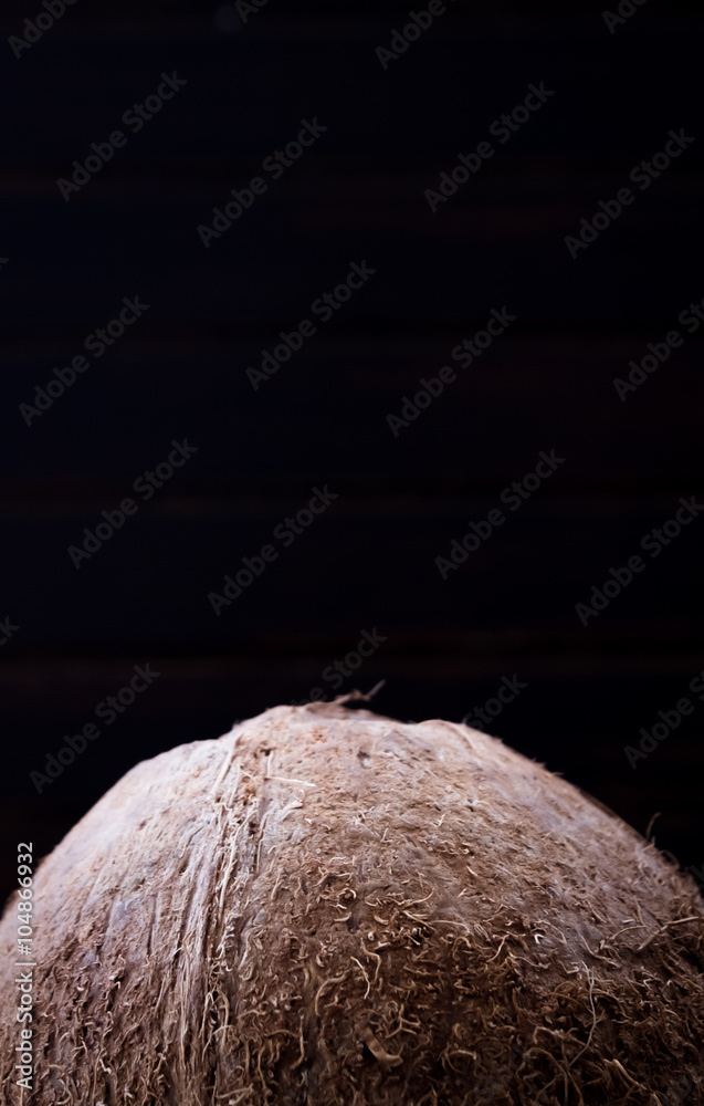 Coconut on black background 