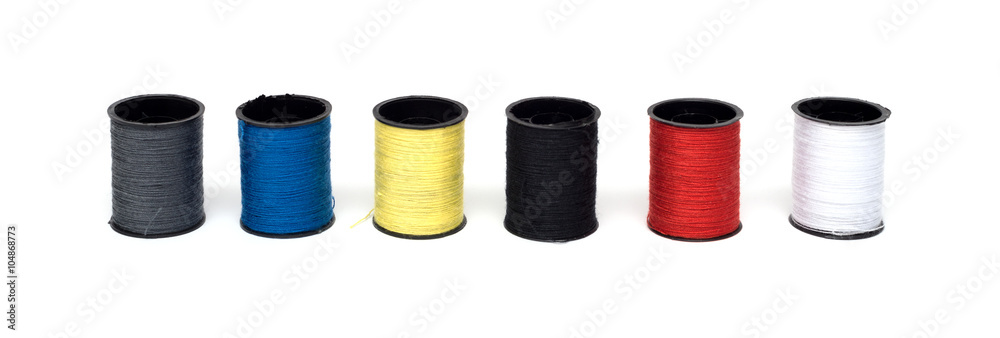 set of color threads on a white background set of color threads on a white background