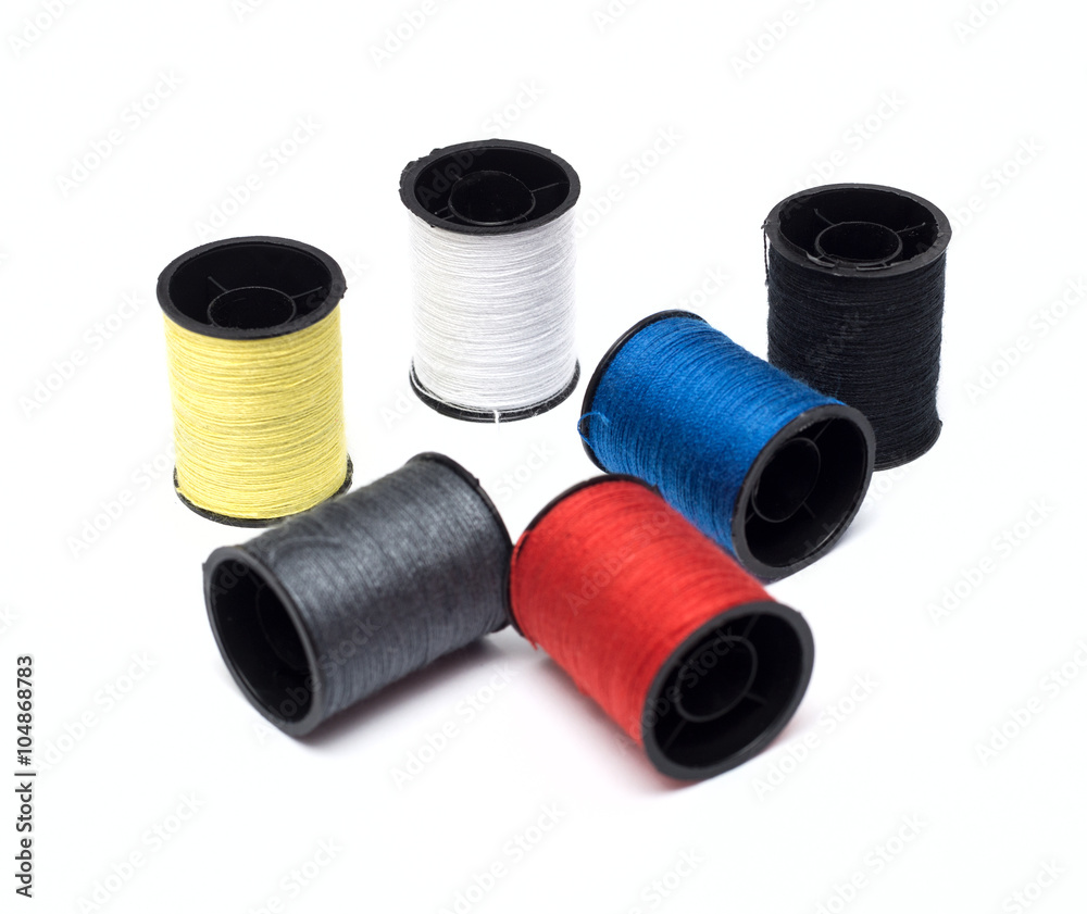 set of color threads on a white background set of color threads on a white background