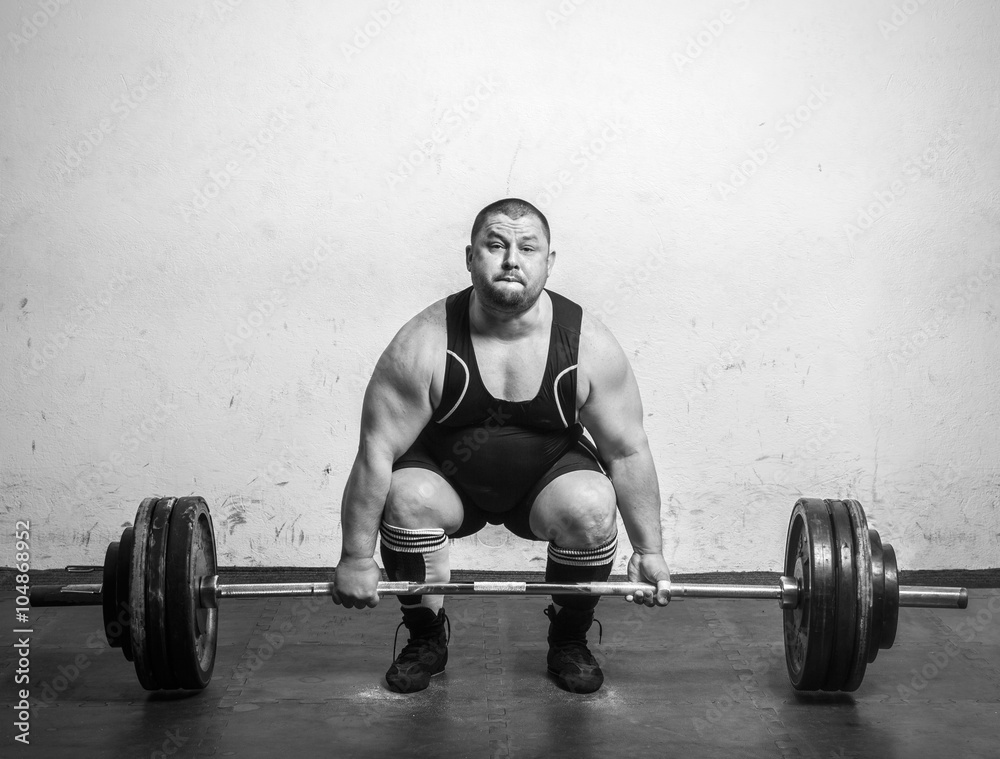 Champion Powerlifter with strong arms lifting weights Champion Powerlifter with strong arms lifting weights