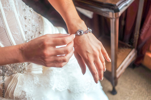 Bridal hand with silver bracelette photo