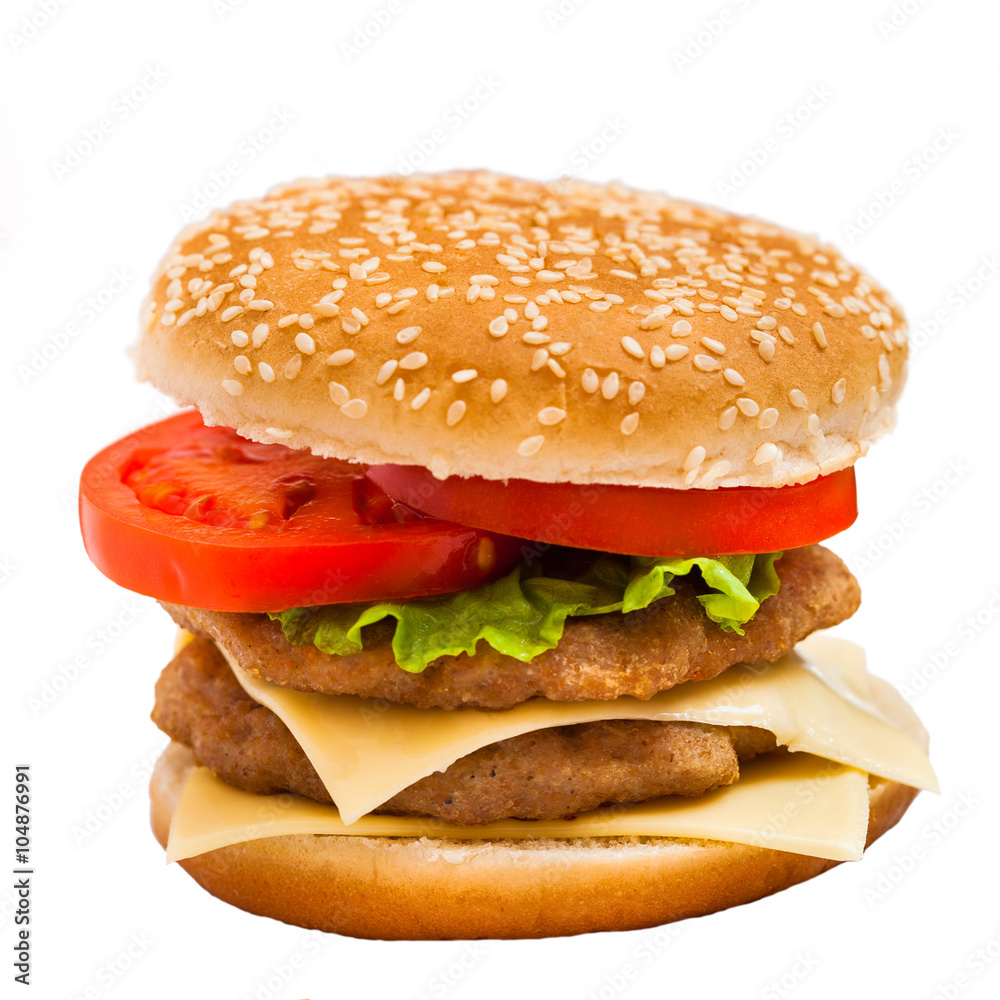 big hamburger with sesame seeds, fresh vegetables and juicy meat