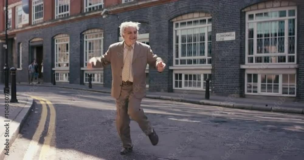 Contemporary funky elderly man street dancer dancing freestyle in the city