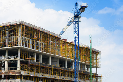 Construction site with crane and building