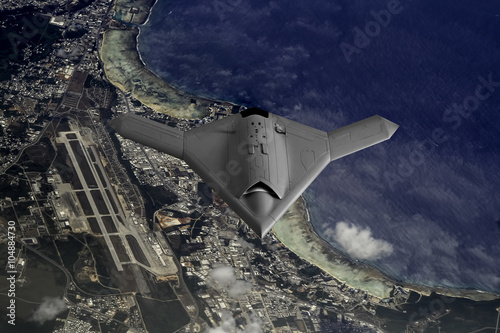 Unmanned Drone flying high over the island of Guam photo