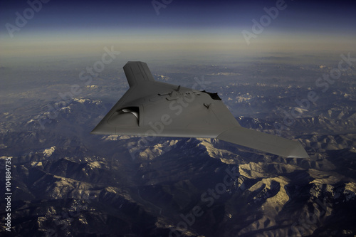 Unmanned Drone flying high over mountains photo