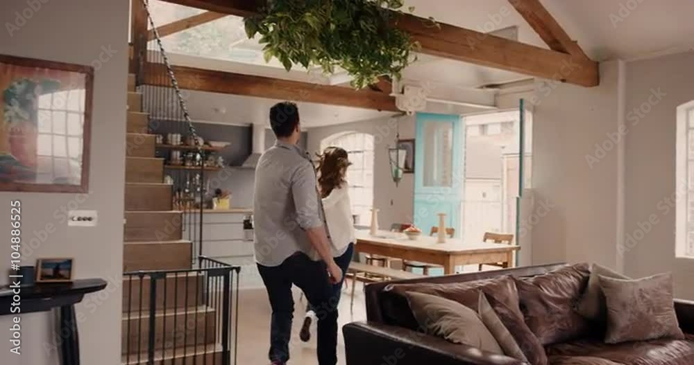 Excited Young couple exploring new home together