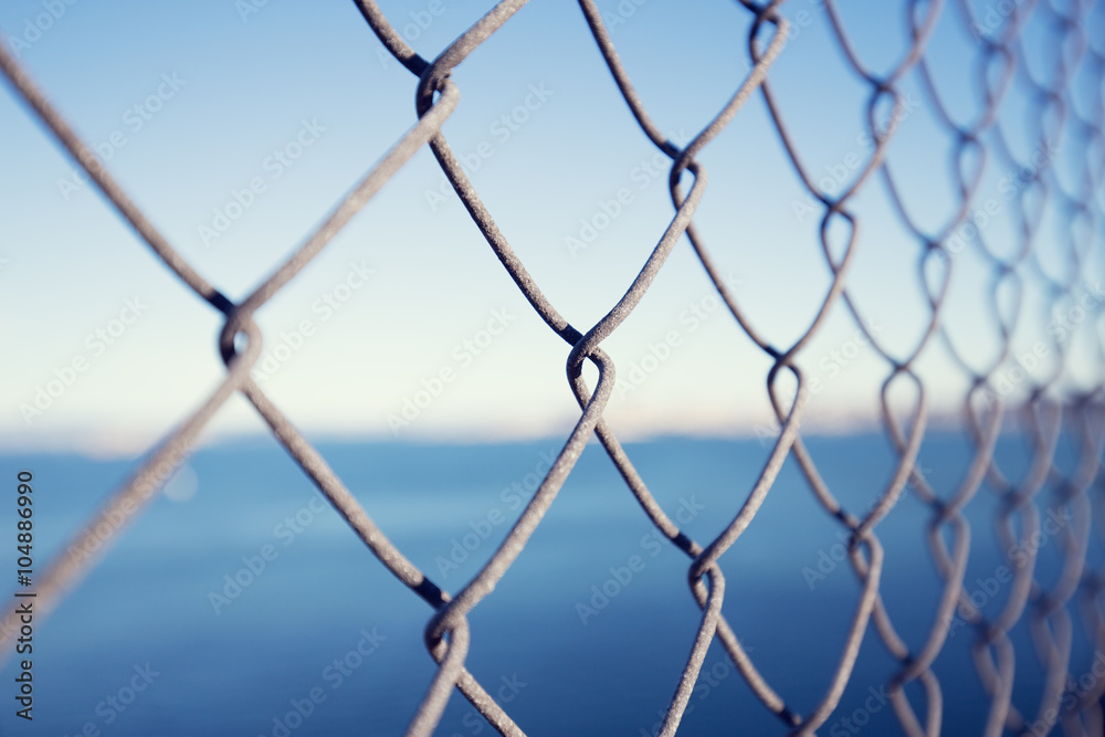 steel net with sea background steel net with sea background