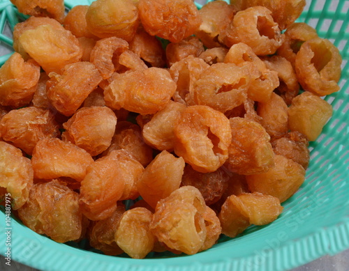 dry longan in plastic basket