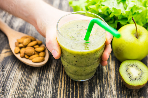 Wallpaper Mural Healthy green smoothie with kiwi and apples on  wooden background Torontodigital.ca