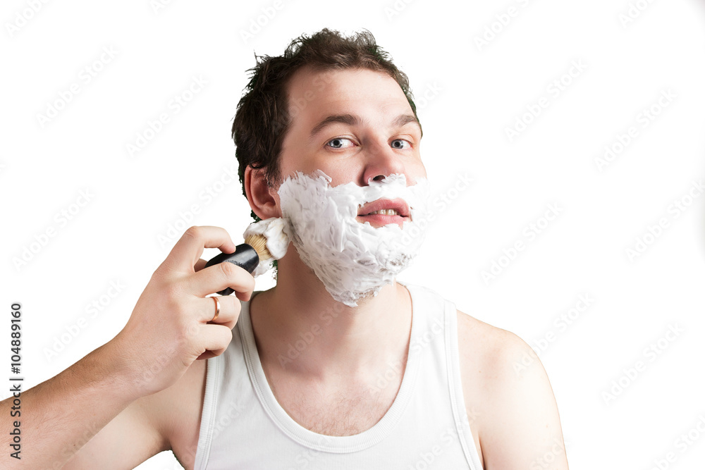 Young man with foam on the face Young man with foam on the face