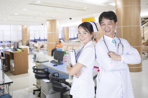 Doctor and nurse with a commitment in the hospital.