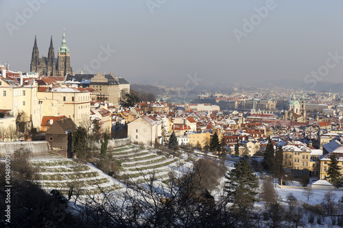 Romantic snowy Prague City with gothic Castle, Czech Republic