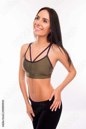 Portrait of beautiful young athletic girl posing in sportswear
