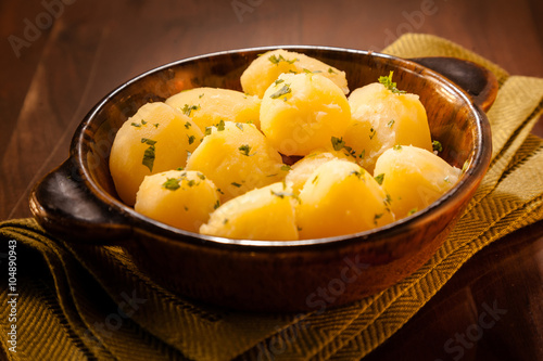 Fotografie Baby boiled potatoes with parsley