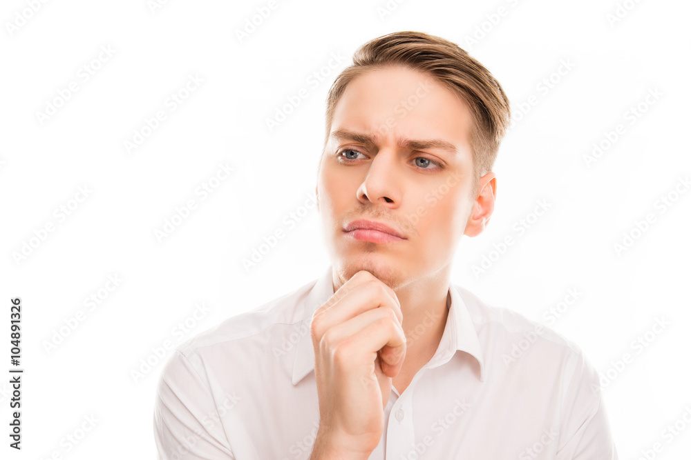 Portrait of serious minded man touhing his chin Portrait of serious minded man touhing his chin