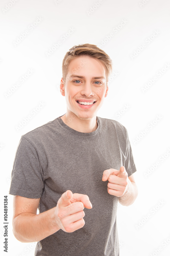 Smilling handsome man gesturing and pointing on you Smilling handsome man gesturing and pointing on you