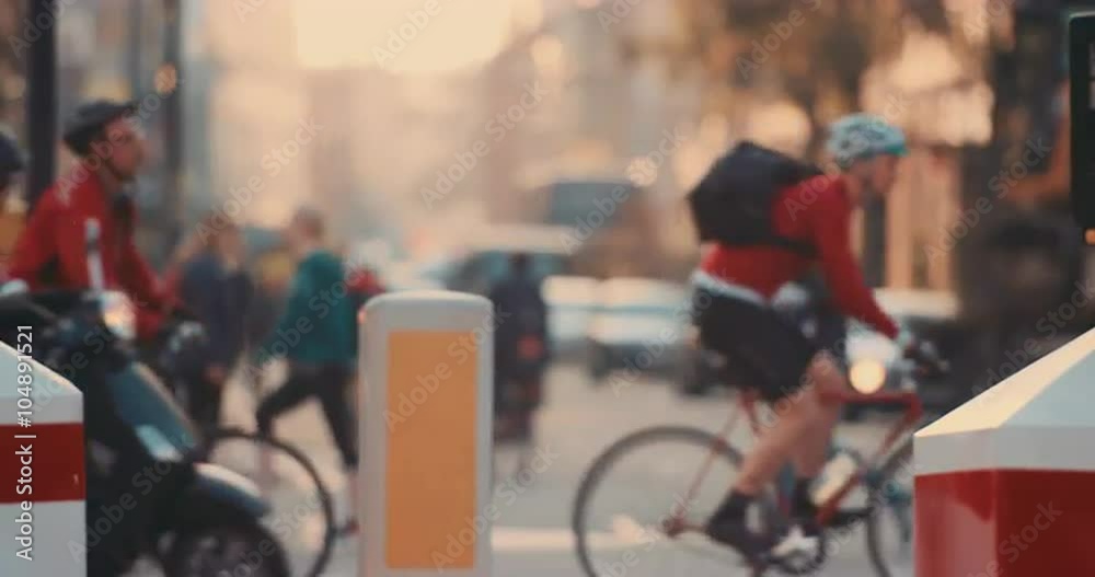 Anonymous crowd of people walking cycling bicycles commuters London City street slow motion
