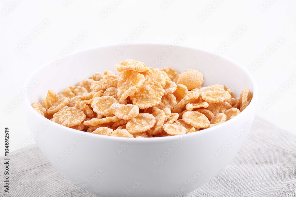 granola in white bowl on white background granola in white bowl on white background
