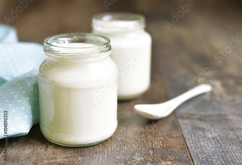 Homemade yogurt in a glass jar.