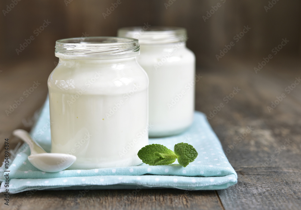 Homemade yogurt in a glass jar. Homemade yogurt in a glass jar.