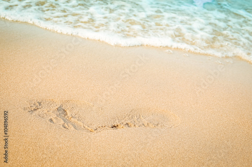 Footprint on sand beach