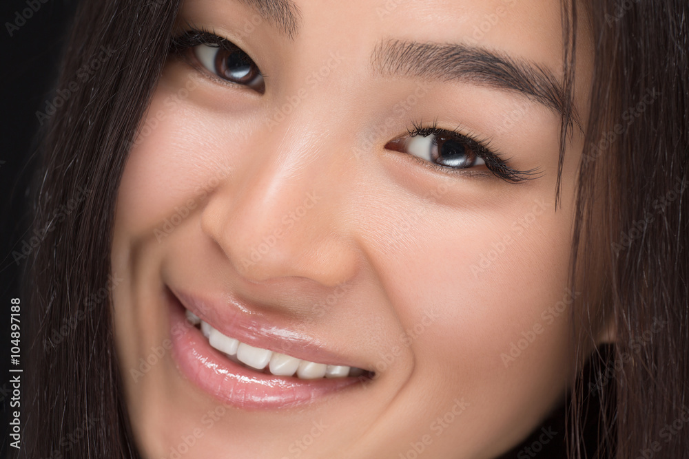 Close-up of smiling Asian woman in studio Close-up of smiling Asian woman in studio