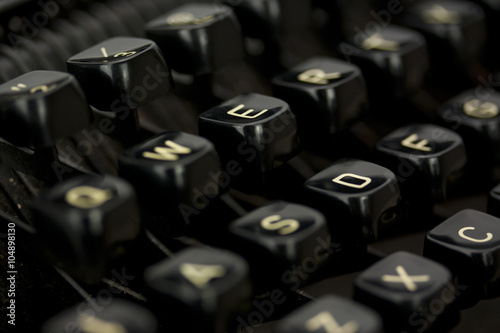 Close up of lettered keys on an old typewriter.