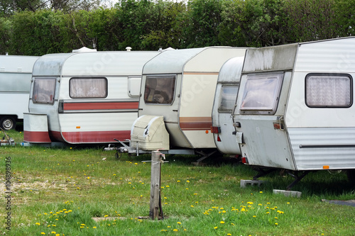 Row of Old-fashioned caravans on a camping site in Belgium. photo