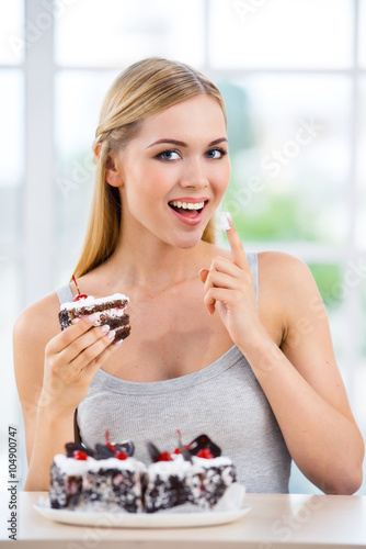 Young woman with chocolate cake