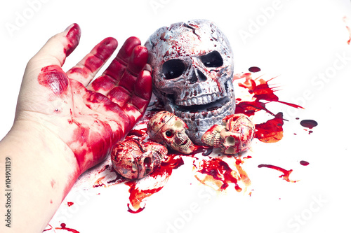 skull Conceptual image with blood on it resting on tiles on the floor