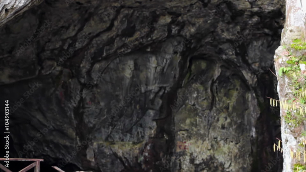 Beautiful waterfall in front of a cave in nature in slow motion shot from top to bottom , Slow Motion Video Clip Beautiful waterfall in front of a cave in nature in slow motion shot from top to bottom , Slow Motion Video Clip