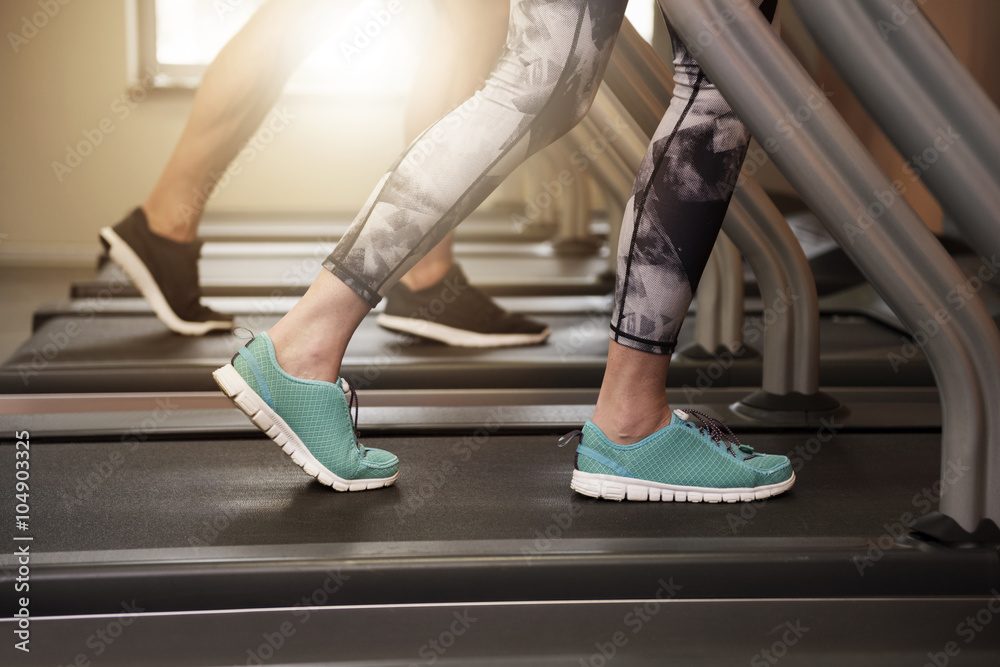Couple jogging on the treadmill Couple jogging on the treadmill