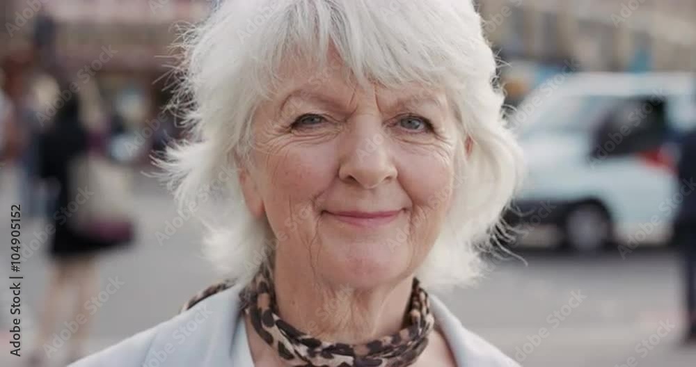Slow Motion Portrait of happy mature old woman smiling