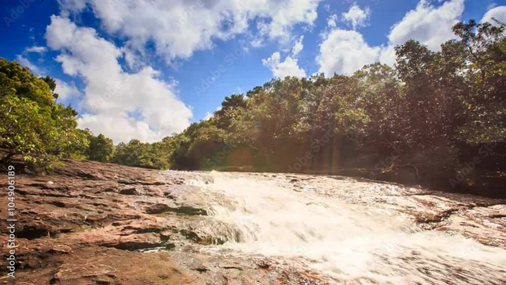 Shallow Mountain River Flows along Stones in Tropical Forest Shallow Mountain River Flows along Stones in Tropical Forest