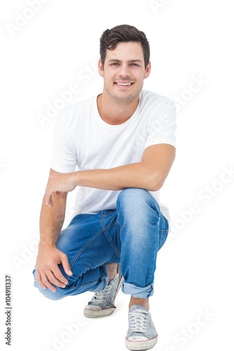 Foto Handsome man crouching