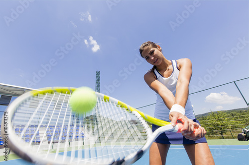 фотографія Beautiful female tennis player in action