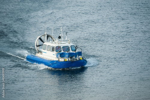 hovercraft crosses the river photo