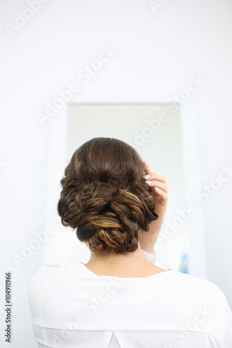 Back of a bride getting ready for wedding