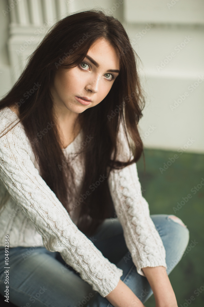 Portrait of a young lady in photostudio interior Portrait of a young lady in photostudio interior