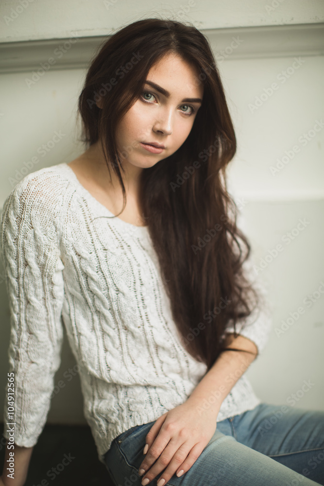 Portrait of a young lady in photostudio interior Portrait of a young lady in photostudio interior