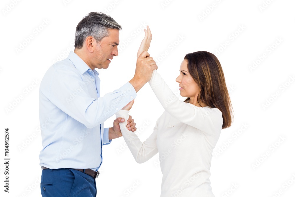 Violent man grabbing wifes wrists