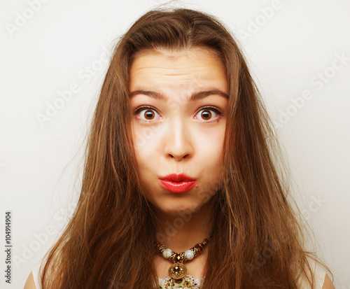Beautiful young surprised woman. 