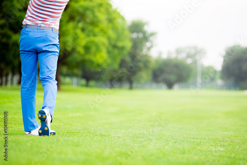 Golfer practicing and concentrating before and after shot