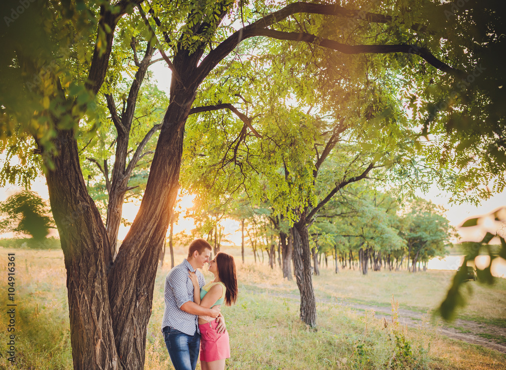 young couple in love walking in nature young couple in love walking in nature